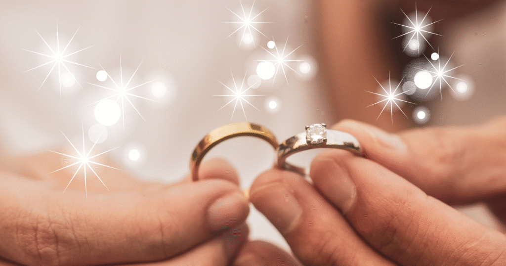 結婚指輪を持っ手